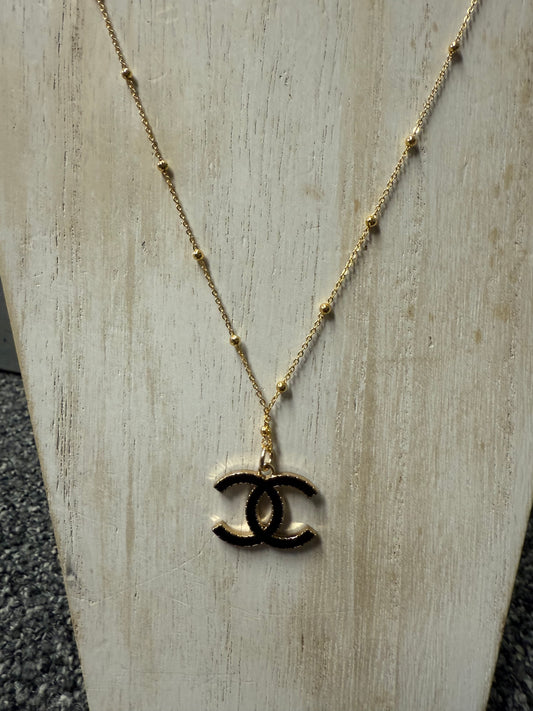 Gold Tone Necklace with Black Accent Pendant